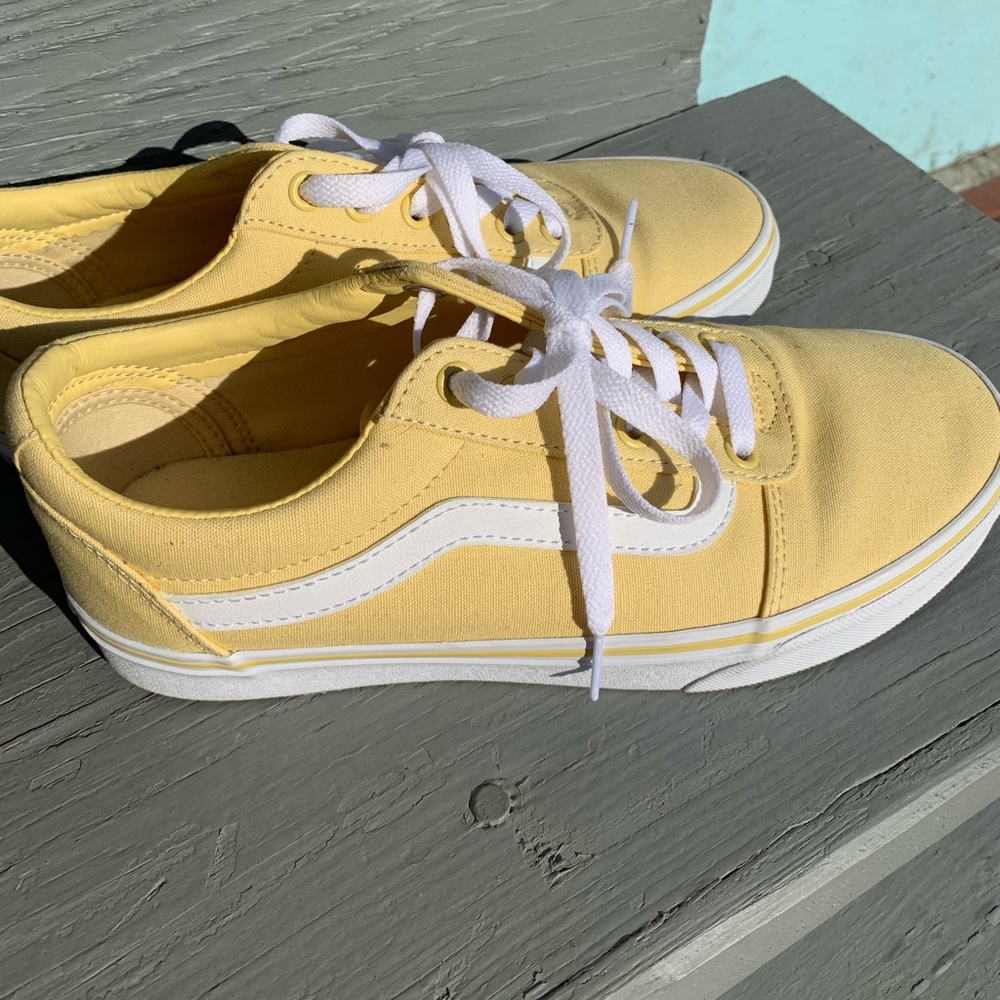 Woman’s yellow Vans